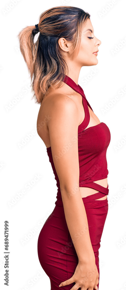 Young beautiful woman wearing casual clothes looking to side, relax profile pose with natural face with confident smile. Young beautiful woman wearing casual clothes looking to side, relax profile pose with natural face with confident smile.