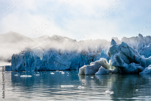 Melting ice of the Monacobreen Glacier in Liefde Fjord, Svalbard, global warming in the arctic ocean
 photo