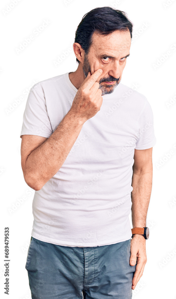 Middle age handsome man wearing casual t-shirt pointing to the eye watching you gesture, suspicious expression Middle age handsome man wearing casual t-shirt pointing to the eye watching you gesture, suspicious expression