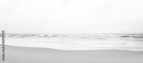 Minimalistic black and white photography of sandy beach perspective. photo