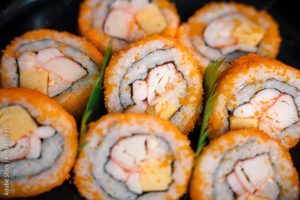 Close up view of Sushi, Roll made of Fresh Raw Salmon, Cream Cheese and Avocado inside. Japanese seafood sushi roll macro image Close up view of Sushi, Roll made of Fresh Raw Salmon, Cream Cheese and Avocado inside. Japanese seafood sushi roll macro image