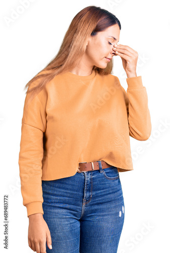Beautiful young woman wearing casual clothes tired rubbing nose and eyes feeling fatigue and headache. stress and frustration concept.