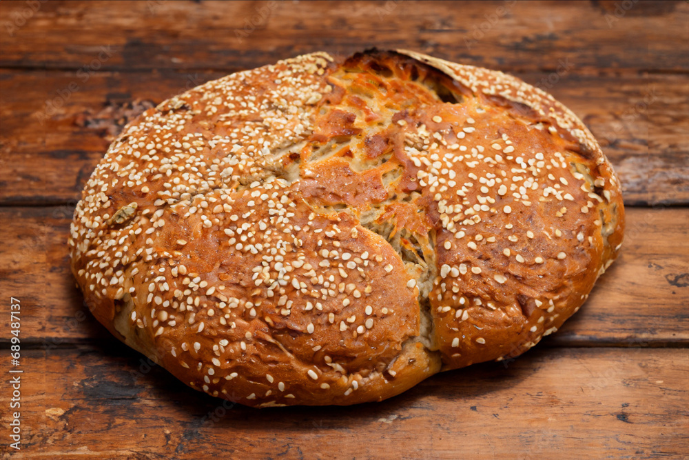 Artisan bread on wooden table Artisan bread on wooden table