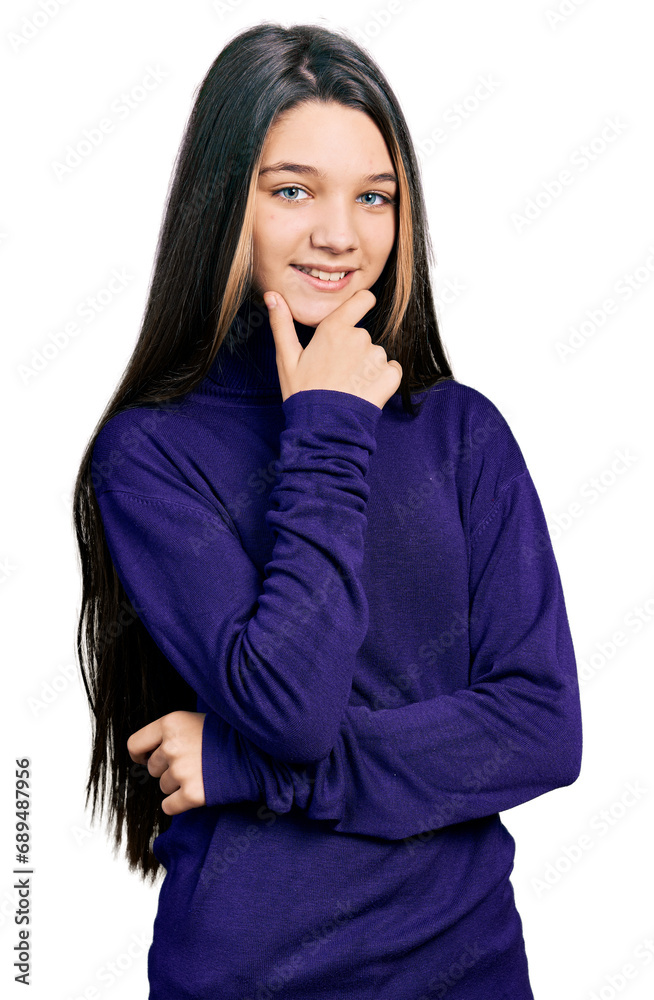 Young brunette girl with long hair wearing turtleneck sweater looking confident at the camera smiling with crossed arms and hand raised on chin. thinking positive. Young brunette girl with long hair wearing turtleneck sweater looking confident at the camera smiling with crossed arms and hand raised on chin. thinking positive.