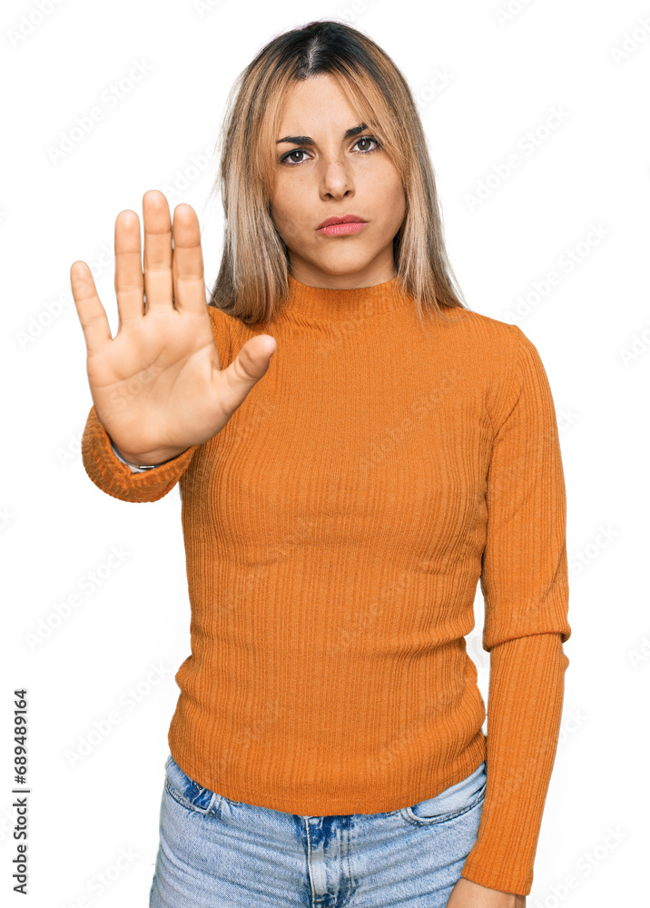 Young caucasian woman wearing casual clothes doing stop sing with palm of the hand. warning expression with negative and serious gesture on the face. Young caucasian woman wearing casual clothes doing stop sing with palm of the hand. warning expression with negative and serious gesture on the face.