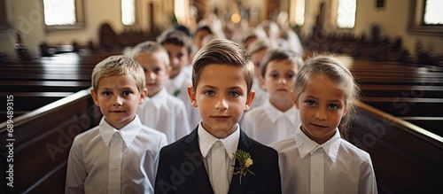 Kids at Catholic church participating in First Holy Communion ceremony