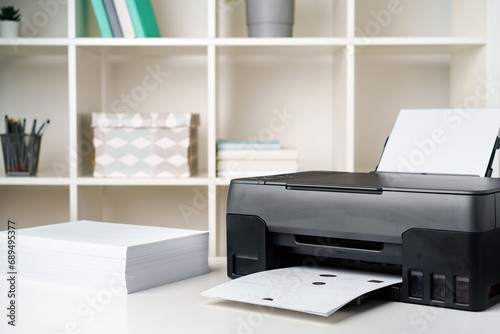 Close up printer copier device on table in the office