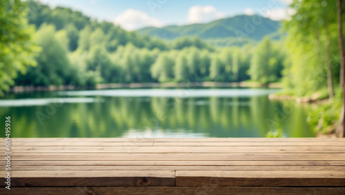 Empty wooden table top with blurred background of lake forest. There are trees in the green background.