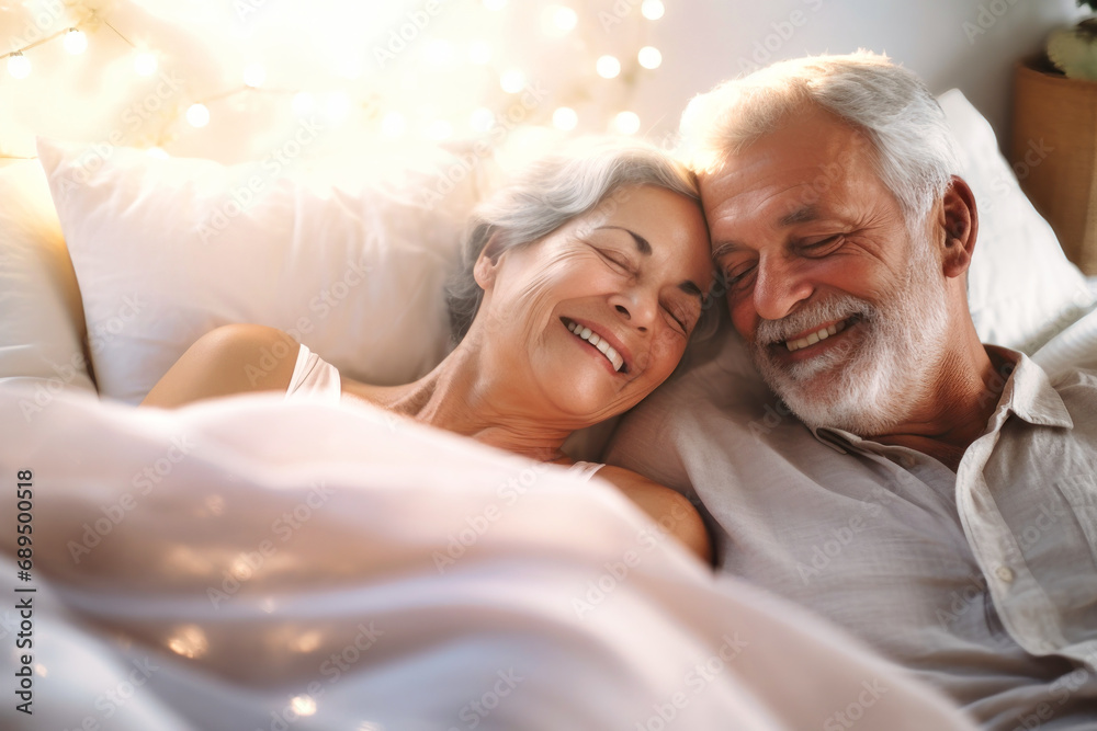 You are the beautiful part of my life. Happy elderly couple cuddling in bed. Romantic feelings. Love. You are the beautiful part of my life. Happy elderly couple cuddling in bed. Romantic feelings. Love.