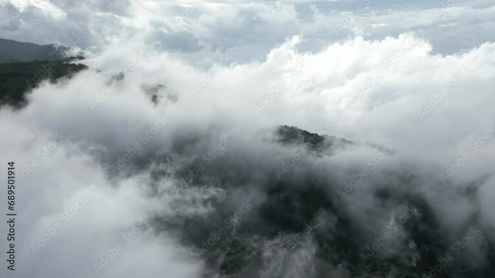 Wispy clouds above the mountains in Bali, Indonesia. Aerial. Wispy clouds above the mountains in Bali, Indonesia. Aerial.