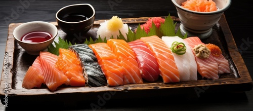 Japanese cuisine that includes raw fish and rice.