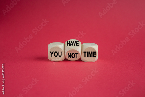 You have or not time symbol. Concept word You have or have not time on beautiful wooden cubes. Beautiful red background. Business and you have or not time concept. Copy space.