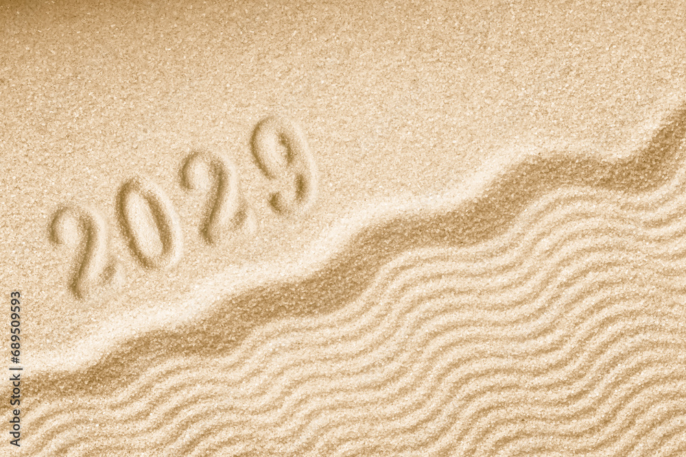 Imprints of numbers 2029 happy new year on a golden sand waves Imprints of numbers 2029 happy new year on a golden sand waves