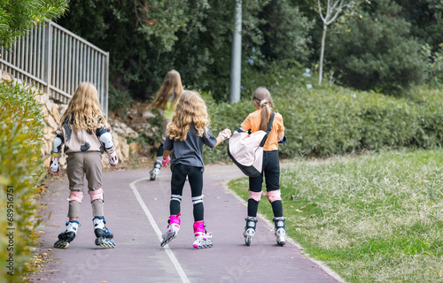 girls roller skating on a treadmill photo