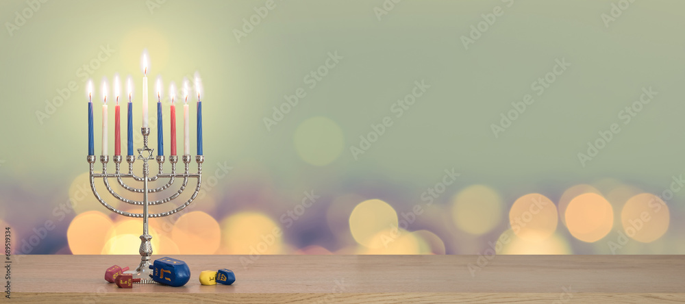 Hanukkah Chanukah Jewish holiday background with menorah (Judaism candelabra candlestick) Hebrew Festival of Lights, Feast of Dedication with burning candle candlelight bokeh and traditional Dreidrel Hanukkah Chanukah Jewish holiday background with menorah (Judaism candelabra candlestick) Hebrew Festival of Lights, Feast of Dedication with burning candle candlelight bokeh and traditional Dreidrel