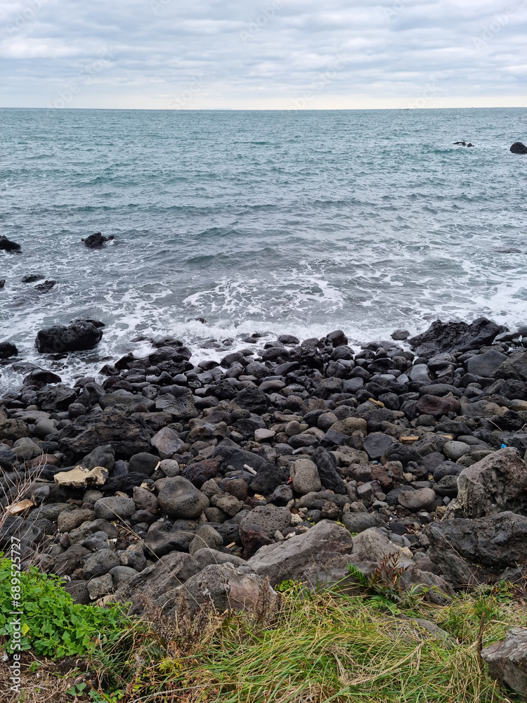 This is a beach in Jeju with basalt rocks. This is a beach in Jeju with basalt rocks.
