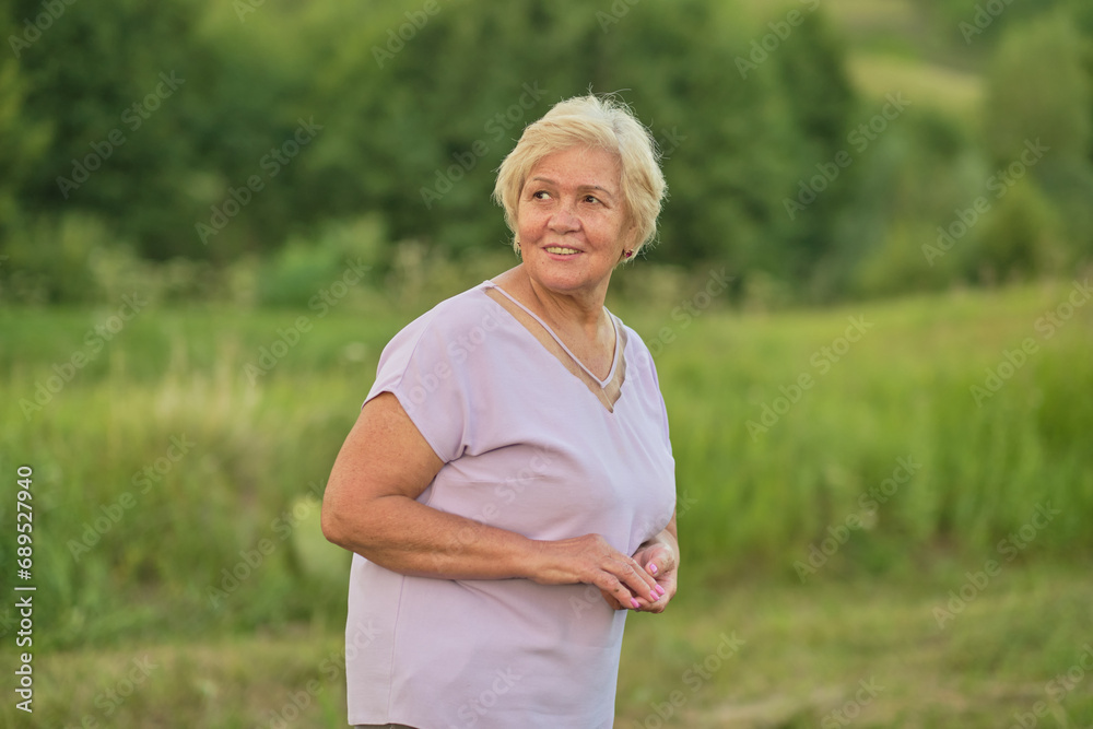 An elder lady in nature, her expression content and relaxed. Illustrates the importance of mental health and well-being in senior care. An elder lady in nature, her expression content and relaxed. Illustrates the importance of mental health and well-being in senior care.