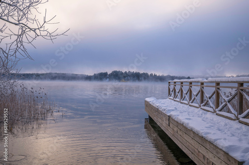 Jetty, smoke, fog, over the lake Mälaren, frost on trees and snow in the Stockholm district Bromma © Hans Baath