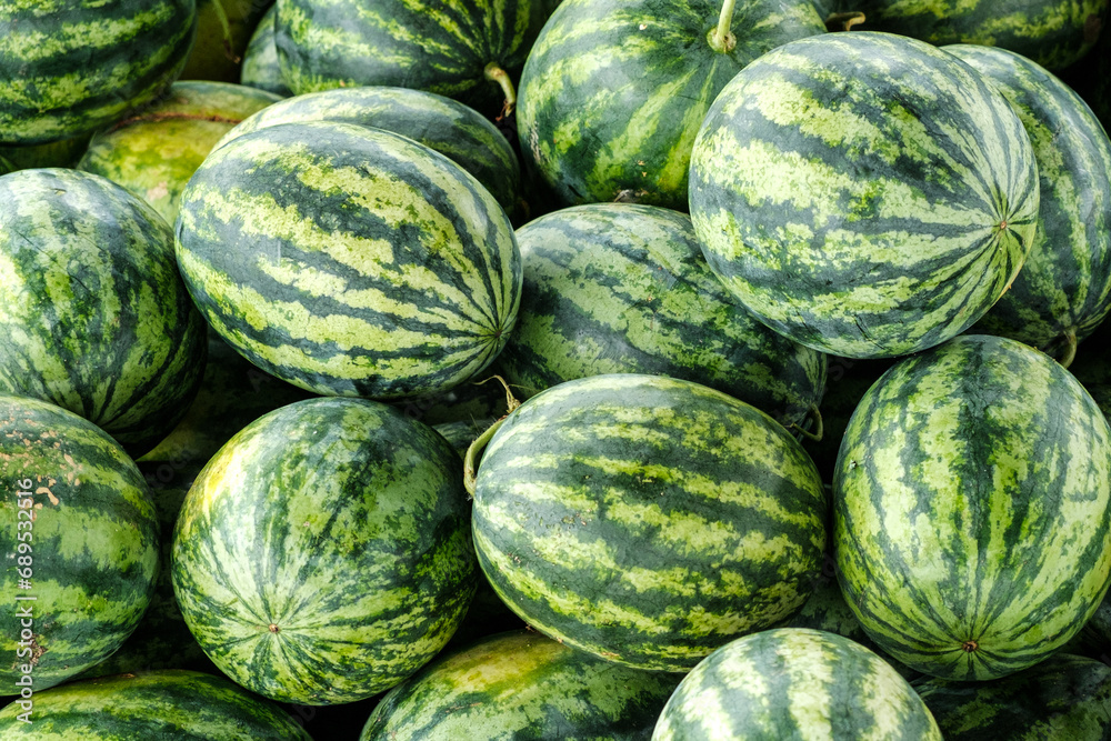 Many big sweet green watermelons at a market in Thailand Many big sweet green watermelons at a market in Thailand