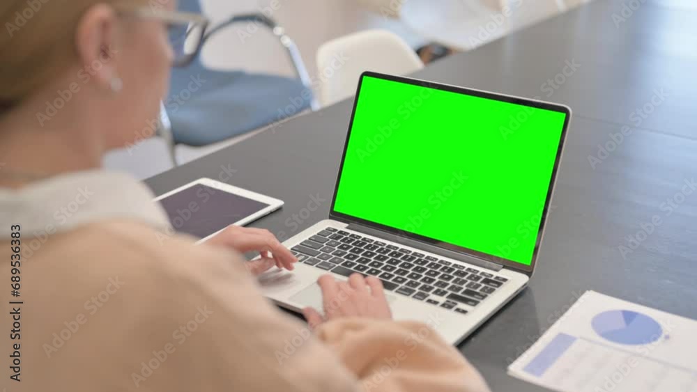 Woman Working on Green Screen Laptop Woman Working on Green Screen Laptop