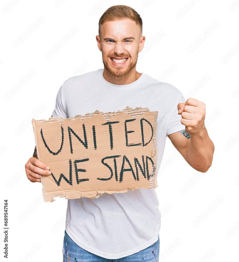 Young irish man holding united we stand banner annoyed and frustrated shouting with anger, yelling crazy with anger and hand raised
