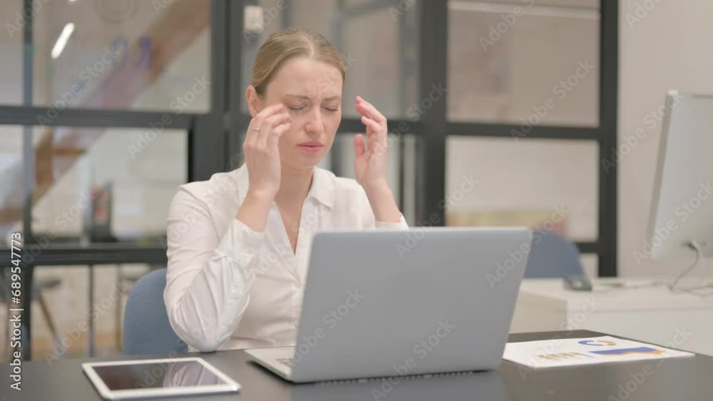 Mature Business Woman having Headache at Work Mature Business Woman having Headache at Work