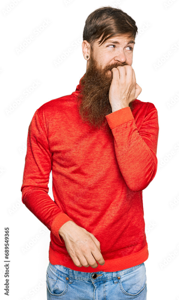 Redhead man with long beard wearing casual clothes looking stressed and nervous with hands on mouth biting nails. anxiety problem. Redhead man with long beard wearing casual clothes looking stressed and nervous with hands on mouth biting nails. anxiety problem.