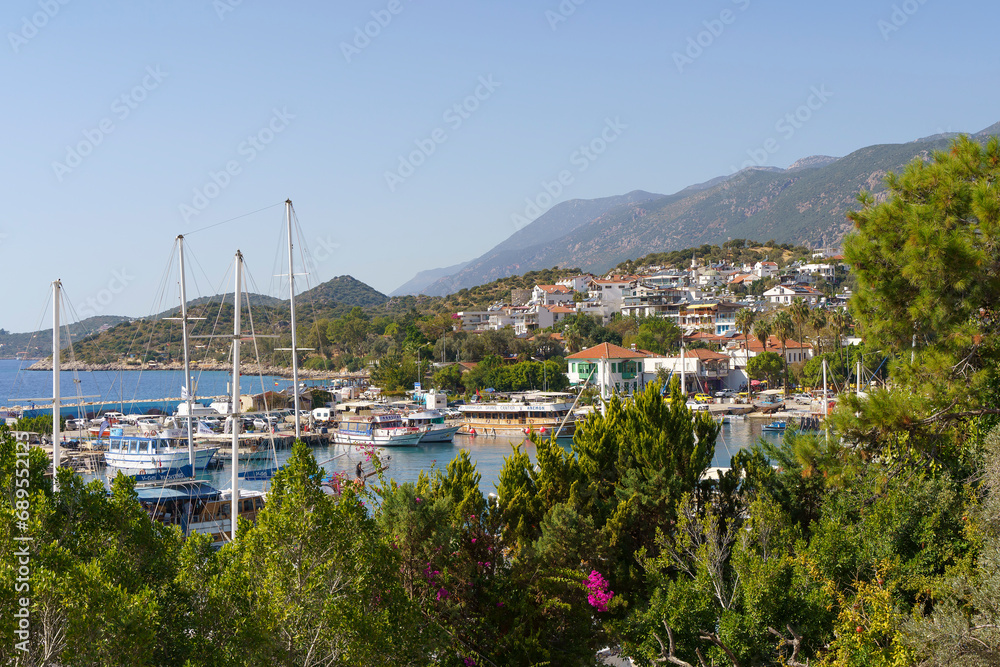 Kash, Turkey - November 29, 2022: View of the panorama of the Turkish city of Kas from above. Tourist attractions of Turkey and Mediterranean Sea. Travel, vacation, tourism concept.