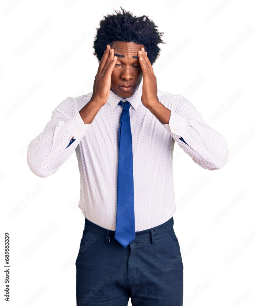 Handsome african american man with afro hair wearing business clothes suffering from headache desperate and stressed because pain and migraine. hands on head. Handsome african american man with afro hair wearing business clothes suffering from headache desperate and stressed because pain and migraine. hands on head.
