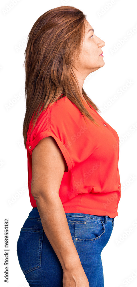 Middle age latin woman wearing casual clothes looking to side, relax profile pose with natural face with confident smile.