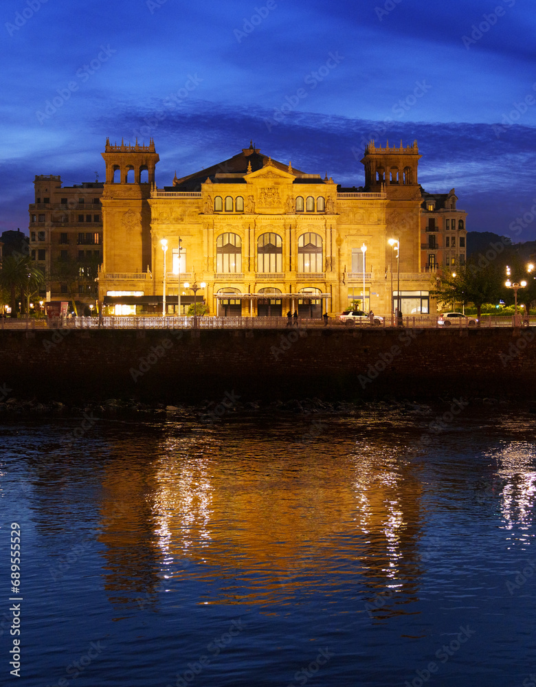 Victoria Eugenia Theater. The Victoria Eugenia Theater illuminated at dusk is located in the city of Donostia San Sebastian, Euskadi.