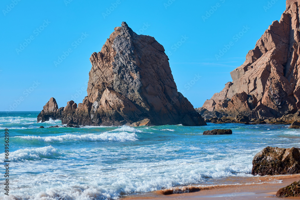 Deserted seashore with rocky cliffs