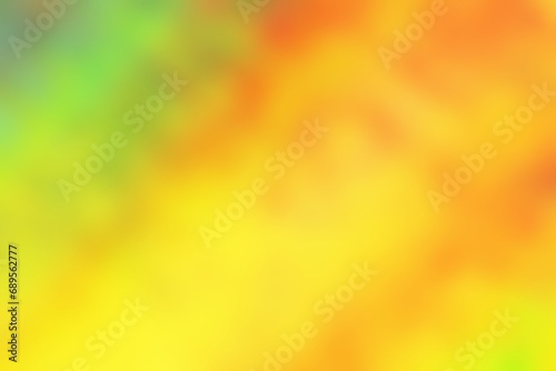 Abstract blurred background image of green, yellow, orange colors gradient used as an illustration. Designing posters or advertisements.