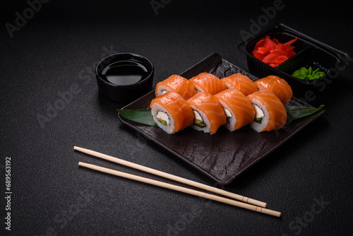 Delicious Philadelphia sushi roll with salmon, shrimp, cucumber and cream cheese