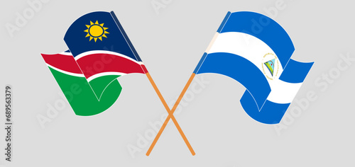 Crossed and waving flags of Namibia and Nicaragua
