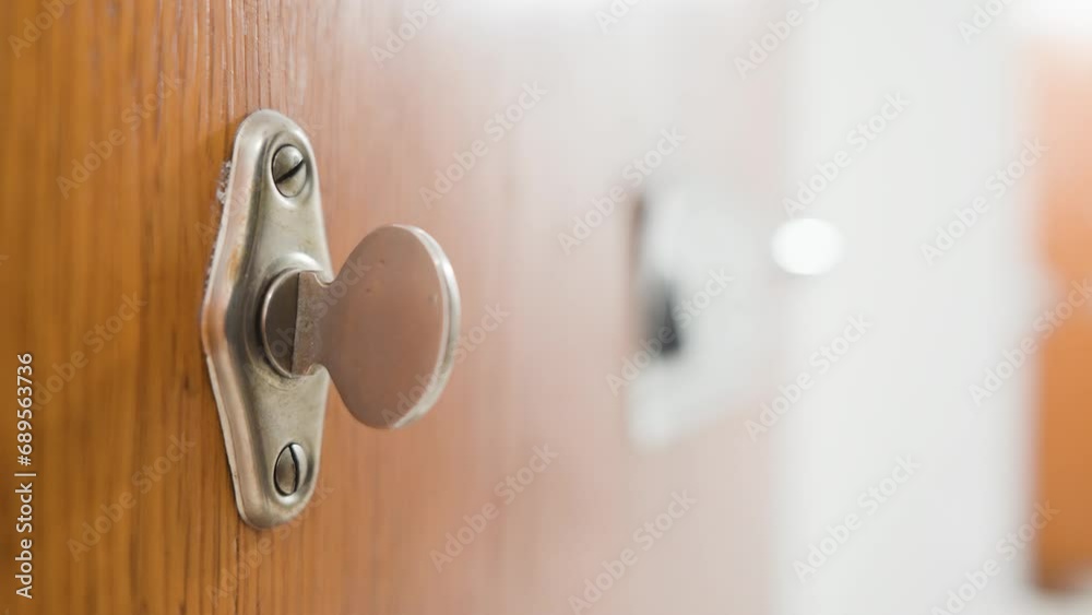 Man ringing an old mechanical doorbell. Close up Man ringing an old mechanical doorbell. Close up