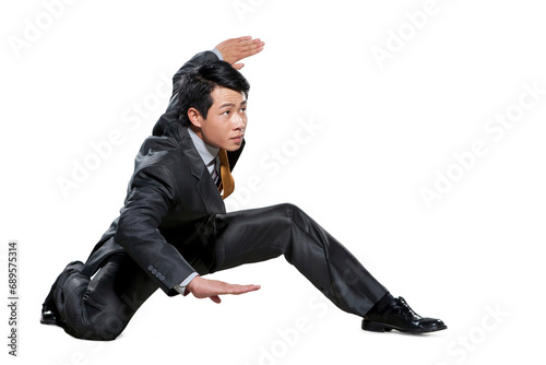 Businessman in martial arts crouching stance photo