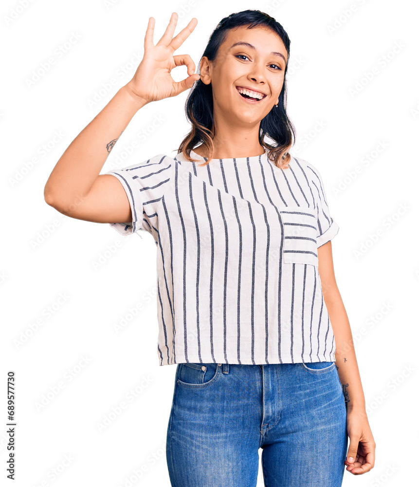 Young woman wearing casual clothes smiling positive doing ok sign with hand and fingers. successful expression.
