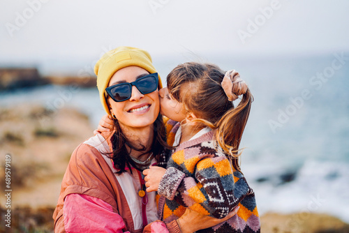 portrait of a mother in love with her child on the beach in cyprus