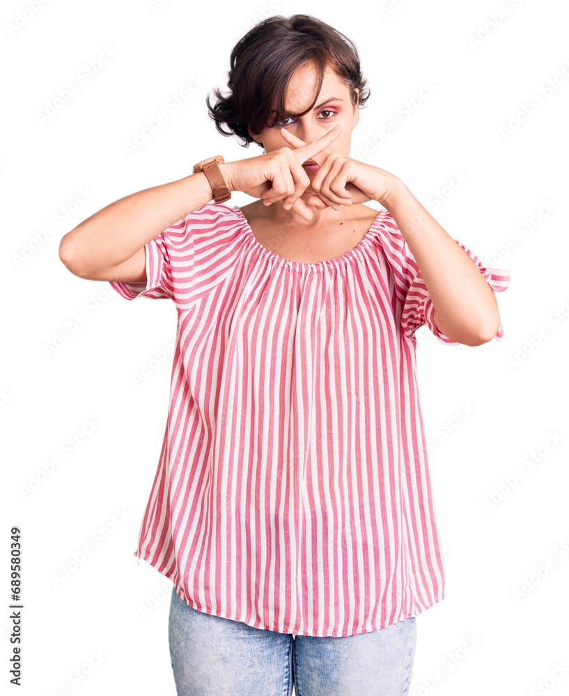 Beautiful young woman with short hair wearing casual summer clothes rejection expression crossing fingers doing negative sign Beautiful young woman with short hair wearing casual summer clothes rejection expression crossing fingers doing negative sign