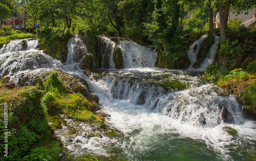 A small waterfall in a stream which runs through the village of Martin Brod in Una-Sana Canton, Federation of Bosnia and Herzegovina. Located within the Una National Park. Early September