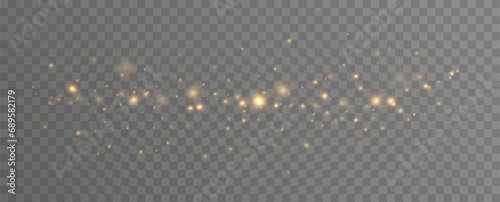 Golden sequins glow with many lights. Glittering dust. Luxurious background of golden particles.