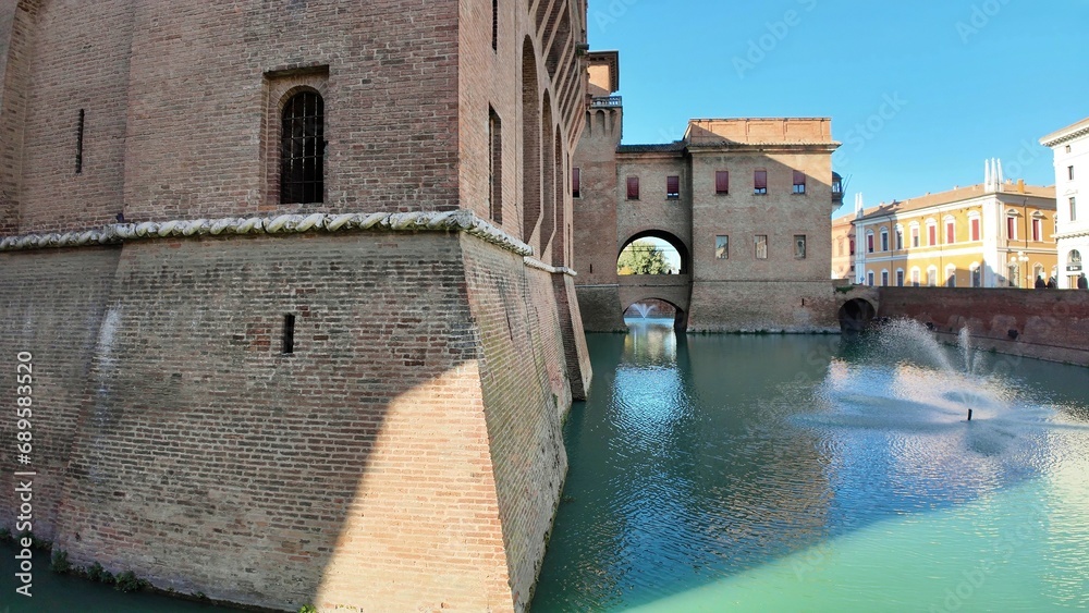 Ferrara Castle, known as Castello Estense, is a medieval fortress in the center of Ferrara, Italy, constructed in 1385. Encircled by moat, the castle comprises a sizable central block with four towers