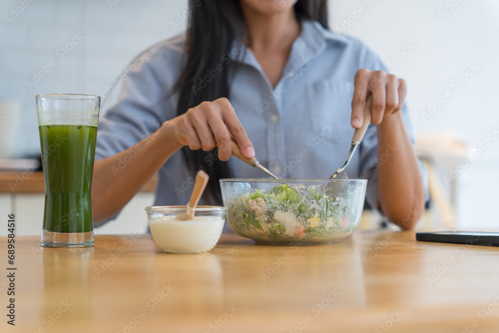 Asian woman dieting Weight loss eating fresh fresh homemade salad healthy eating concept Asian woman dieting Weight loss eating fresh fresh homemade salad healthy eating concept