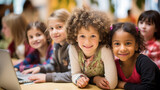 Multiethnic schoolchildren in an elementary school classroom. An interracial elementary school student smiles into the frame.