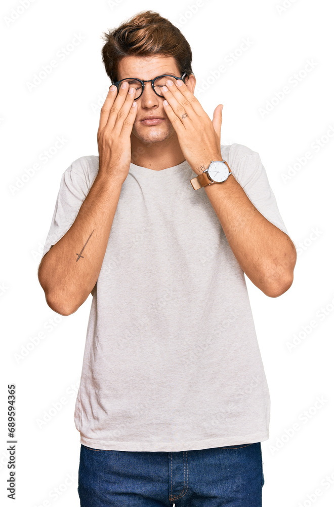 Handsome caucasian man wearing casual clothes and glasses rubbing eyes for fatigue and headache, sleepy and tired expression. vision problem Handsome caucasian man wearing casual clothes and glasses rubbing eyes for fatigue and headache, sleepy and tired expression. vision problem