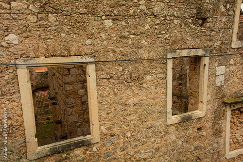 The 'House Within a House', or Kuca U Kuci, in Bol town on Brac Island in Croatia. This shot was taken from the back of the house. In the 19th century, a newer house was built around an existing house photo