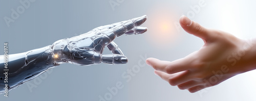 Robot hand coming in contact with human hand  photo