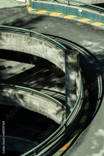 Abandoned parking lot reveals a hauntingly beautiful circular structure, a forgotten echo in an empty urban landscape photo
