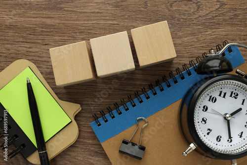 Three wooden blocks with space to insert text on a wooden background. Copy space